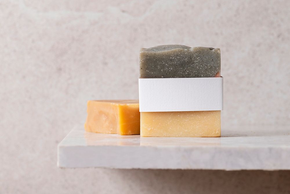Organic bar soap, white product belly band, on bathroom shelf