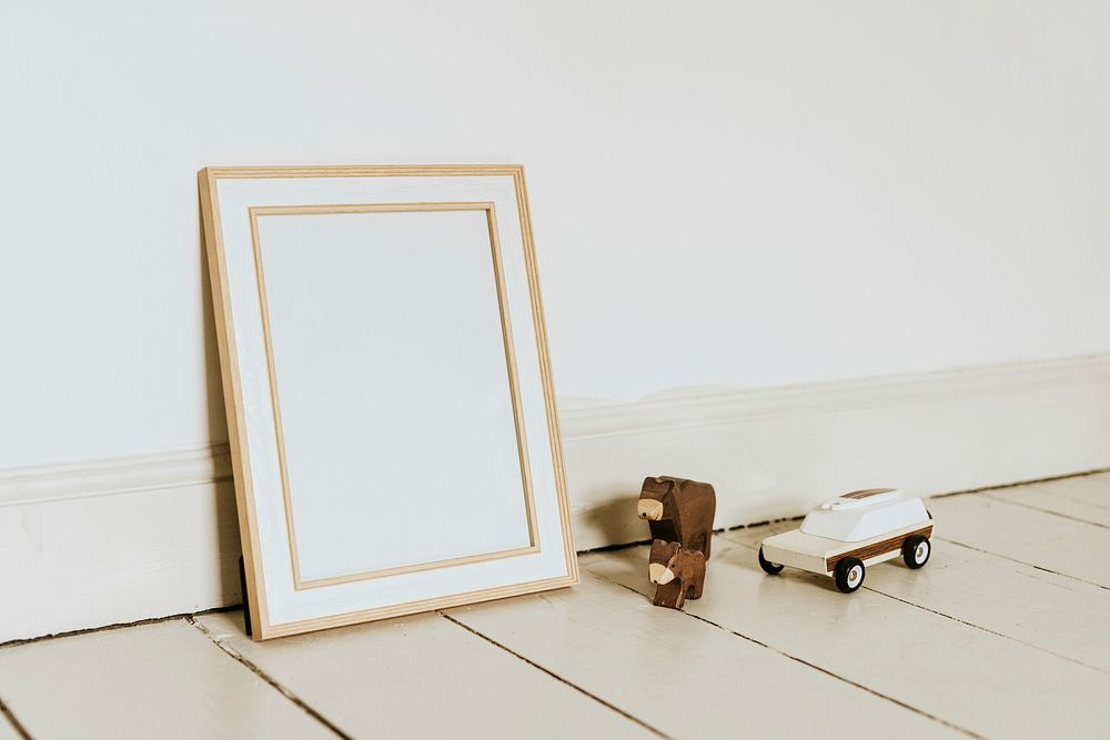 Empty wooden frame, aesthetic kids playroom, home decor