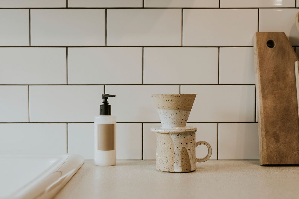 Drip coffee in white tiled kitchen