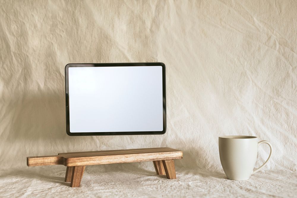 Empty tablet screen, aesthetic wooden shelf 