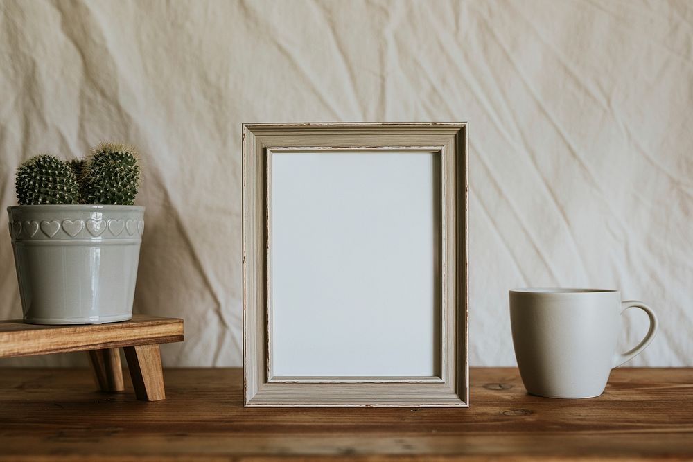 Empty frame & coffee cup, aesthetic home decor