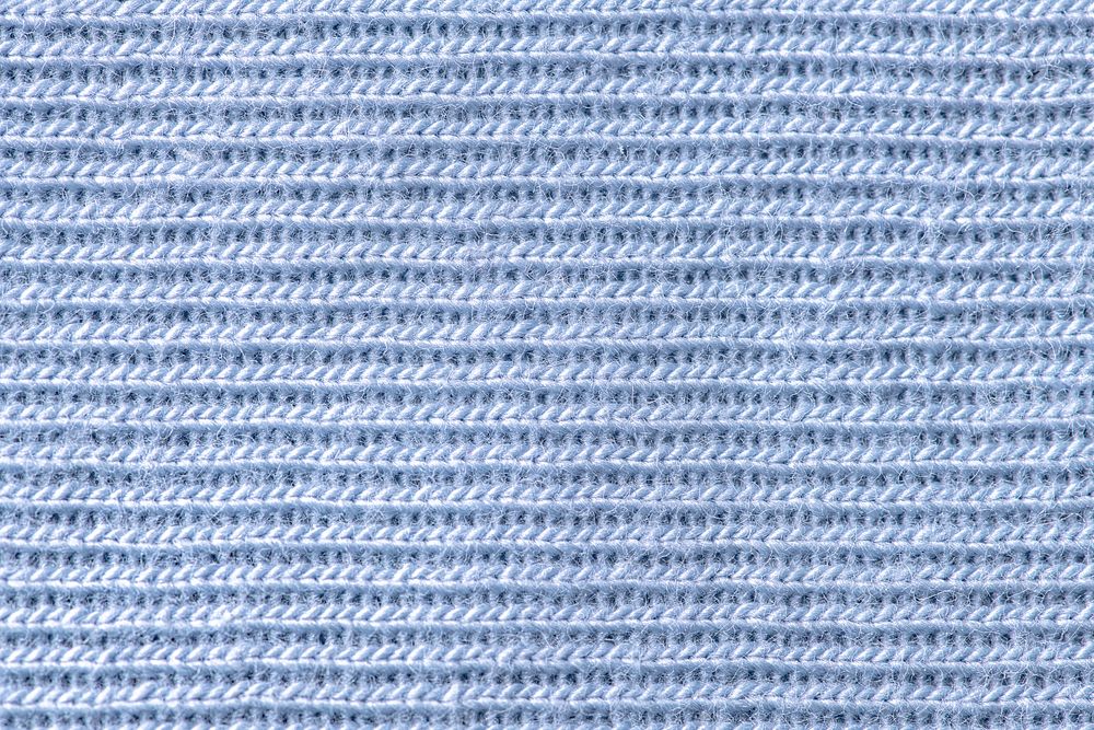 Blue fabric background, knitted texture, macro shot