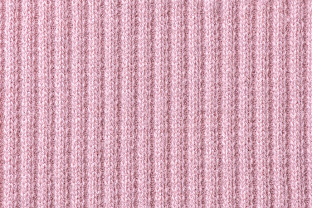 Pink background, knitted fabric texture, macro shot