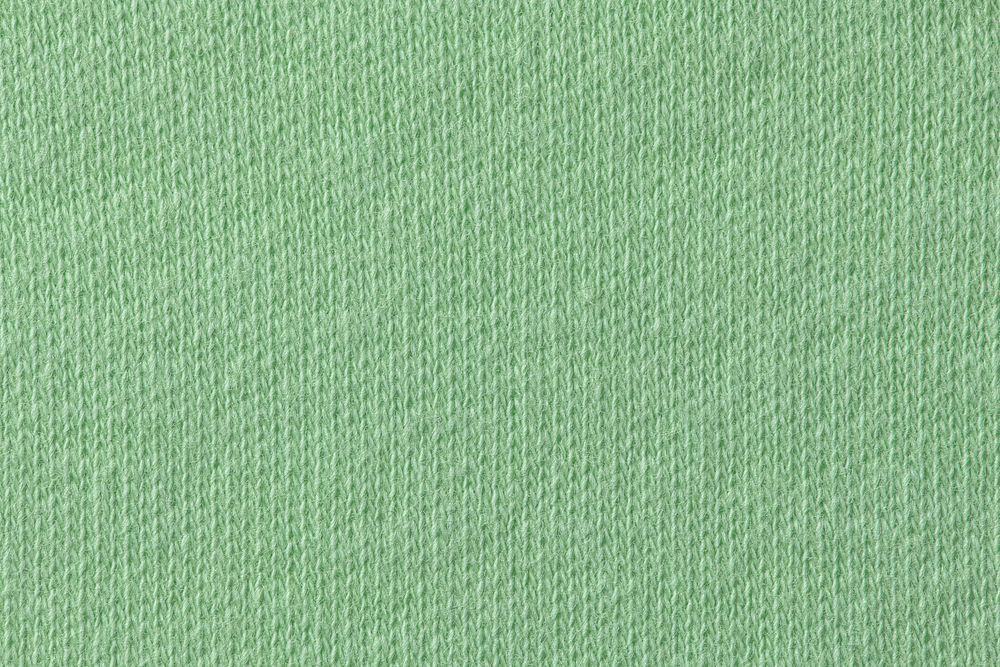 Green background, knitted fabric texture , macro shot design