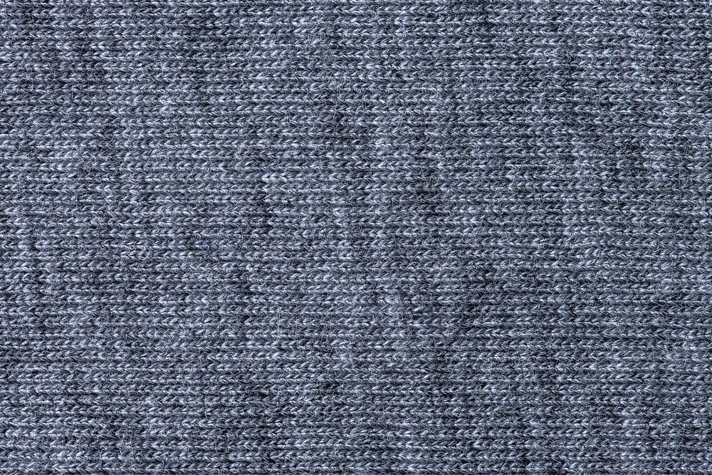Gray background, knitted fabric texture, macro shot