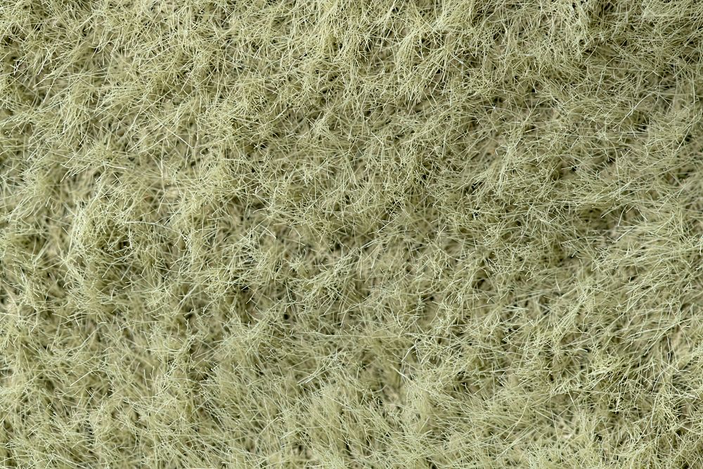 Green fabric texture background, macro shot