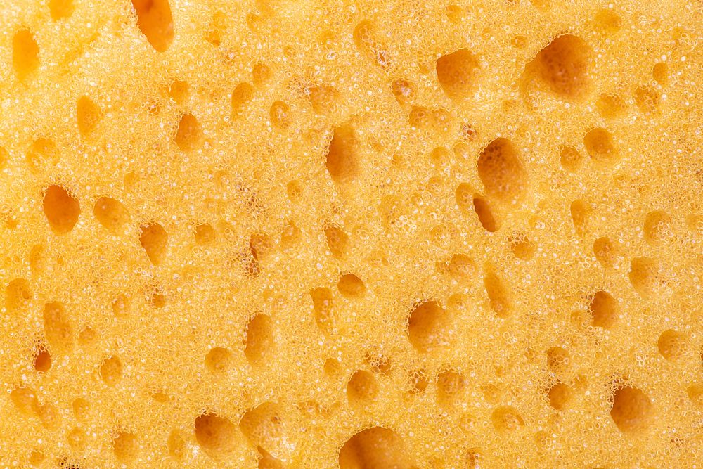 Yellow sponge texture background, design space