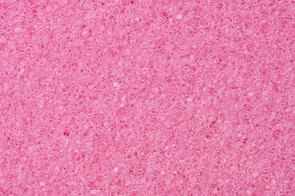 Pink background, sponge texture, macro shot