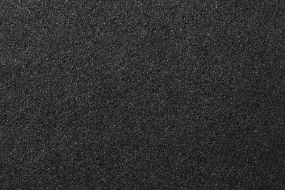 Black background, rough paper texture