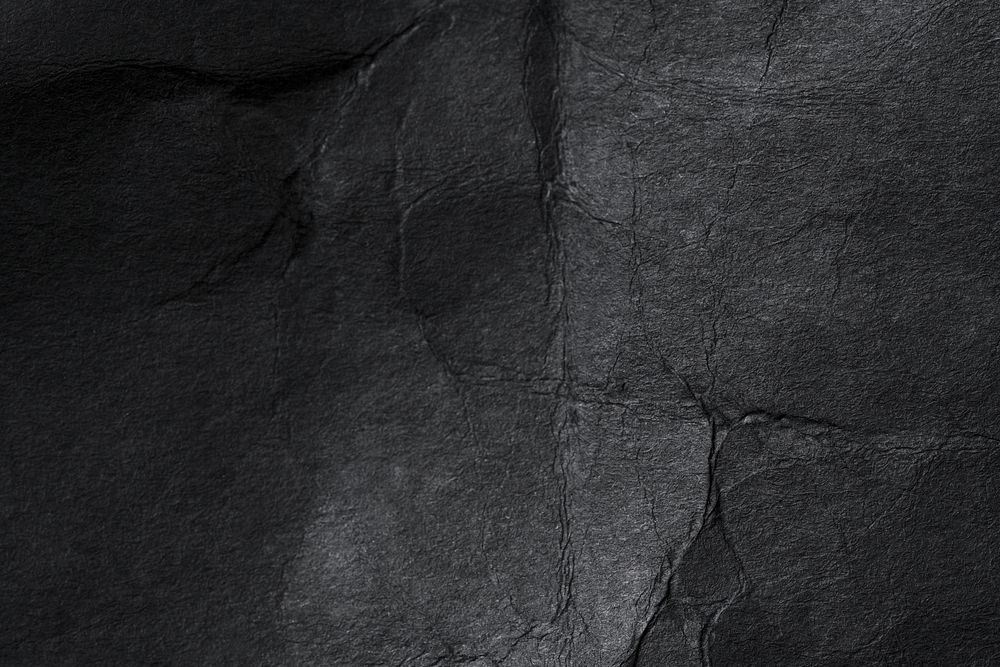 Wrinkled black paper texture background design