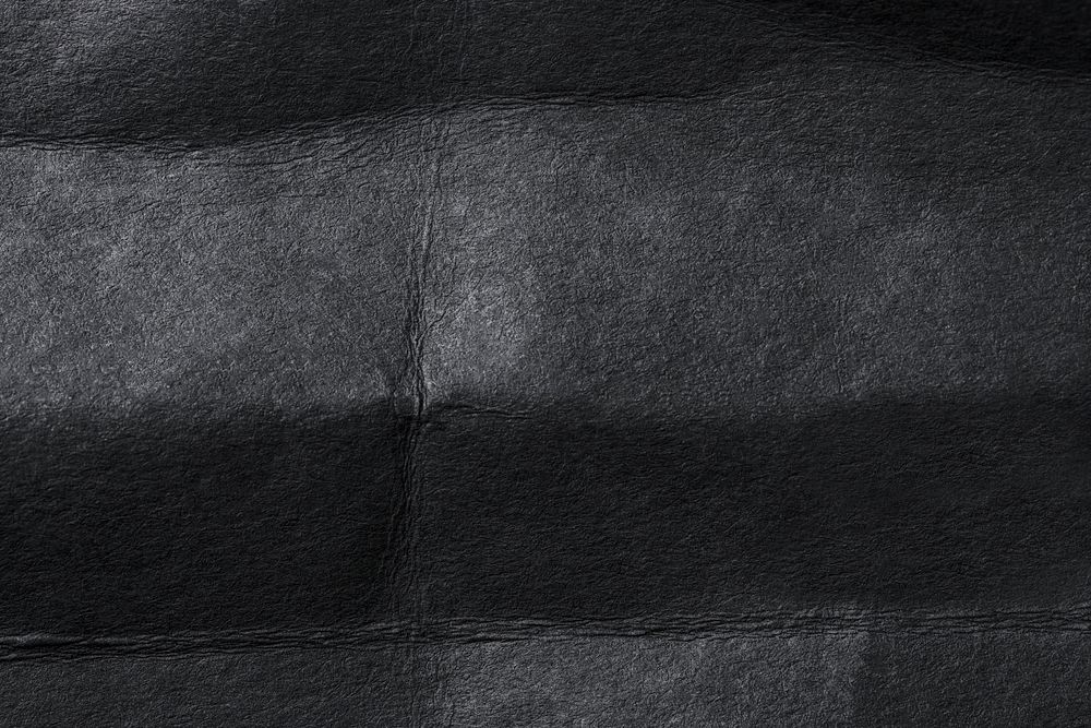 Wrinkled black paper texture background