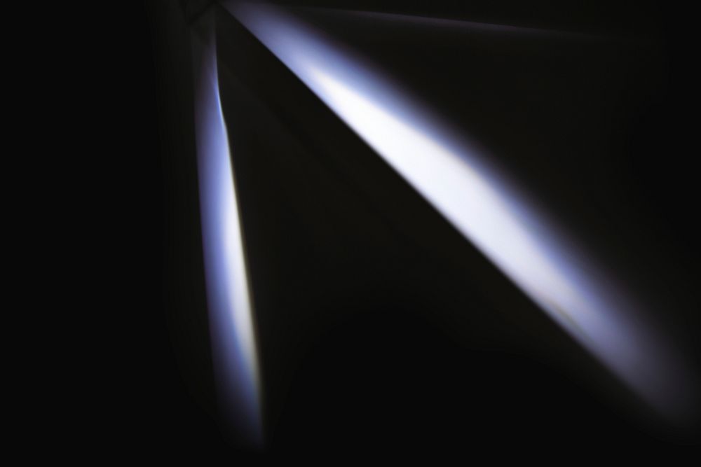 Neon lens flare white spotlight reflection on black background