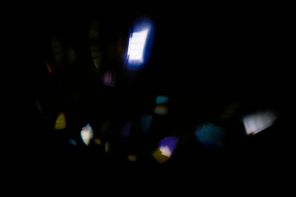 Neon lens flare light reflection on black background 