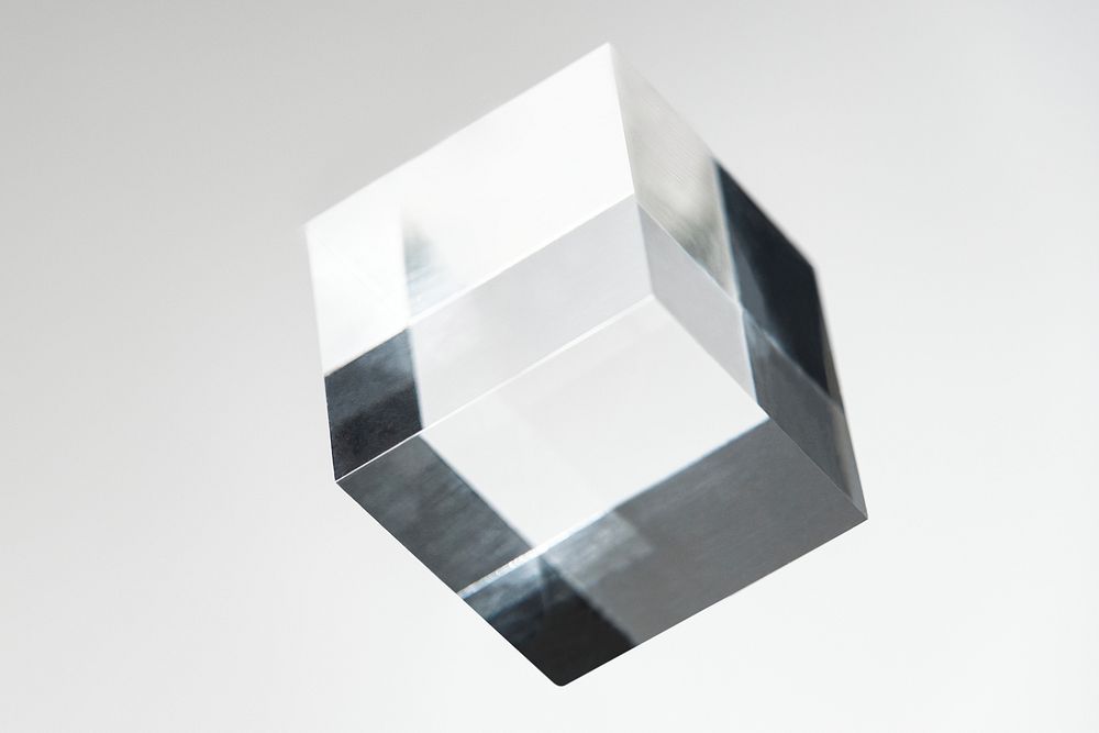 Clear crystal glass cube on white background 