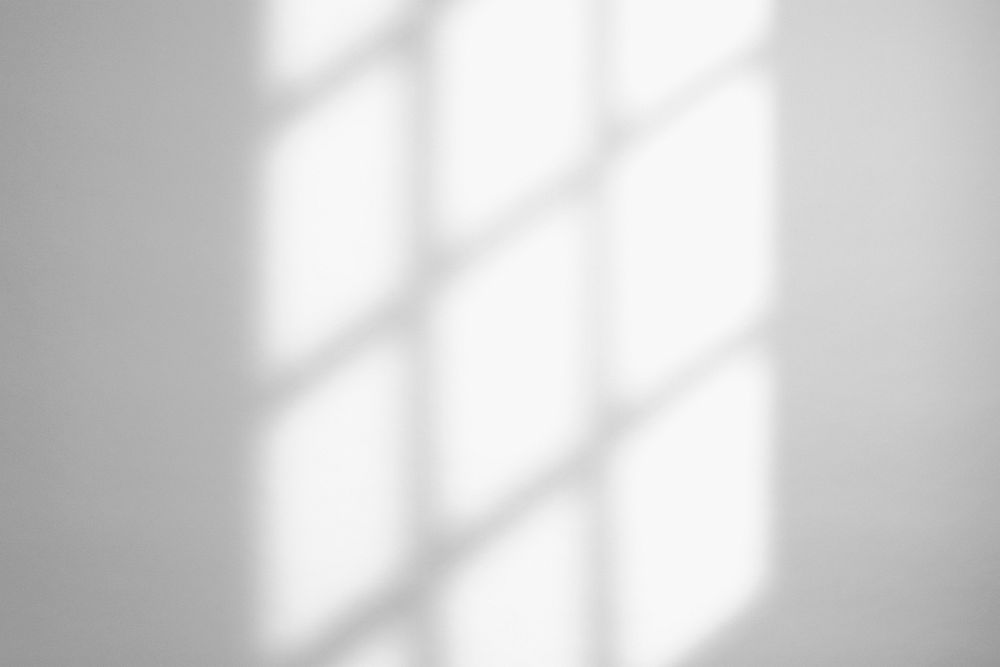 Window light shadow on white wall 