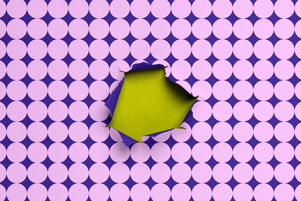 Funky purple background, torn paper hole with geometric pattern