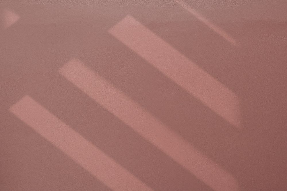 Stair shadow on clean pink textured wall