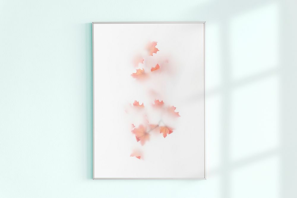 Photo frame on a light blue wall with natural light