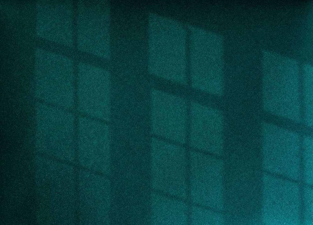 Shadow of window on a green wall