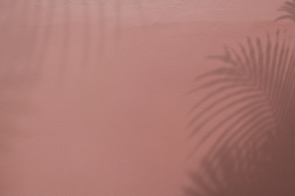 Shadow of palm leaves on cinnamon diamond background
