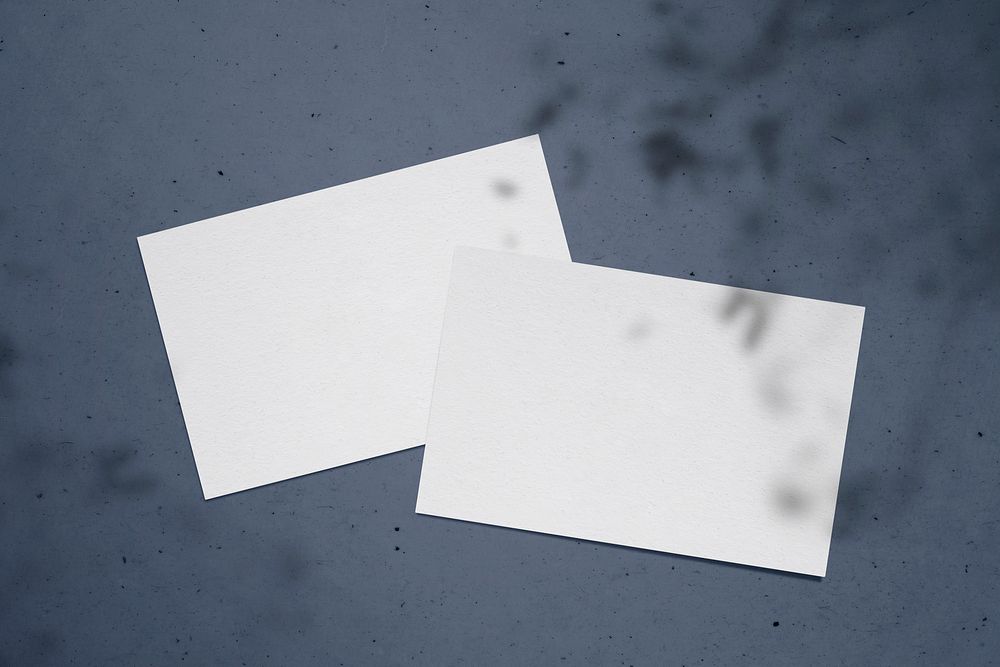 Blank white cards on a dark blue background
