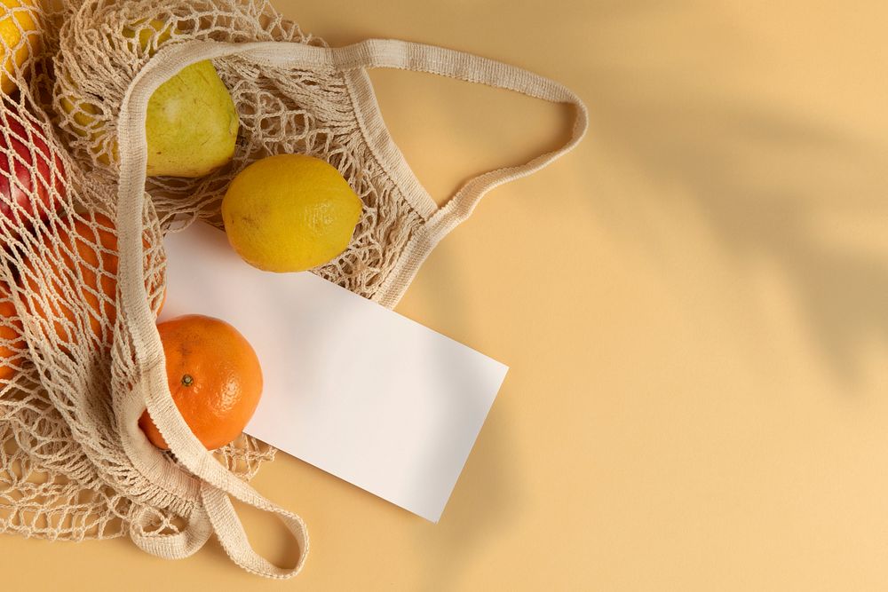 Orange and lemon in a net shopping bag