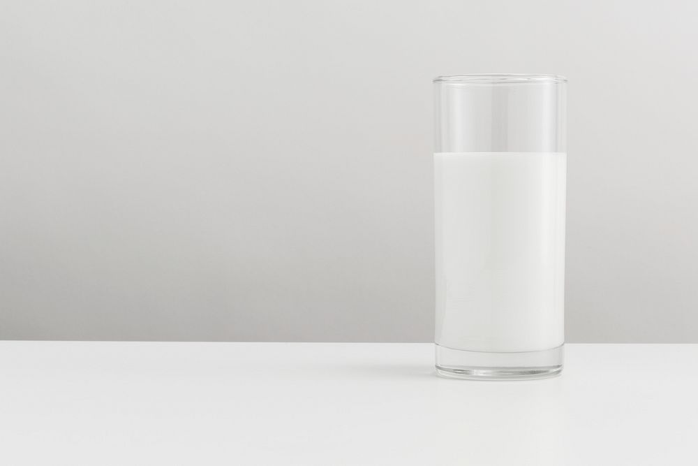 Fresh milk in a glass on a table banner