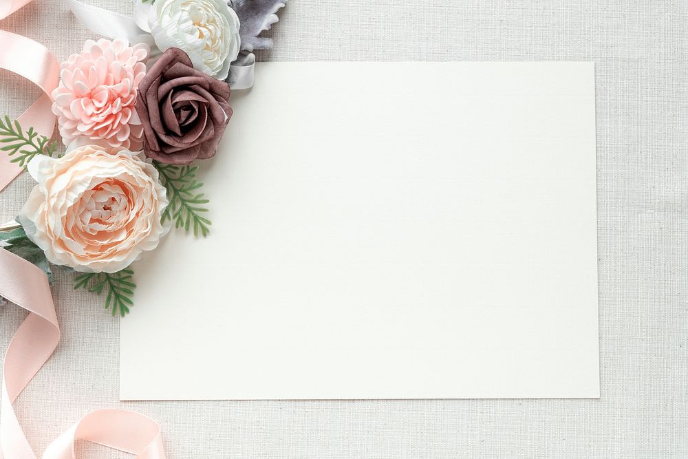 Blank paper note with flowers on fabric textured background