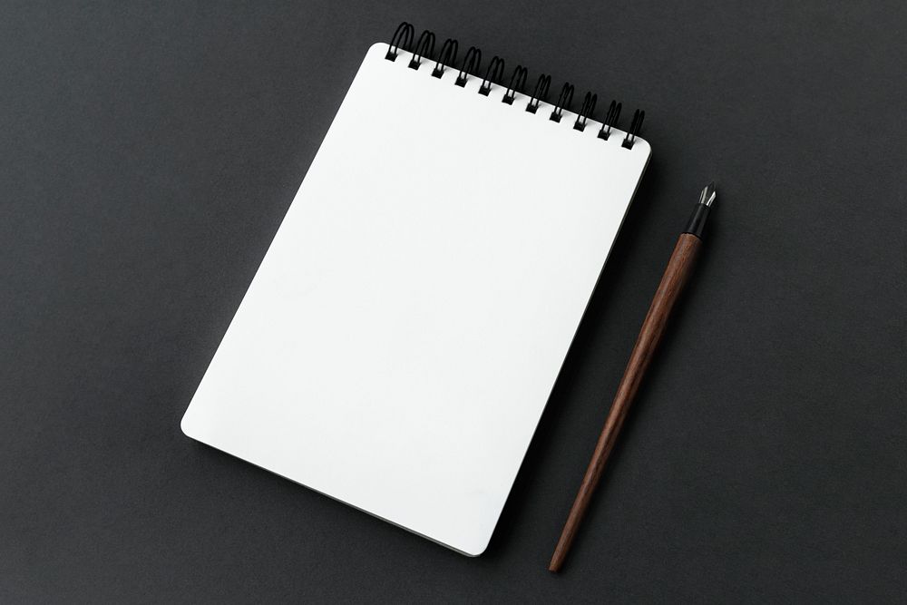 Blank plain white notebook with a fountain pen 
