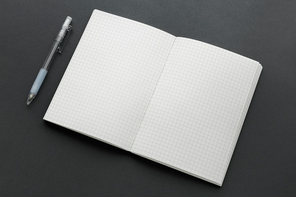 Blank white grid notebook with a pencil