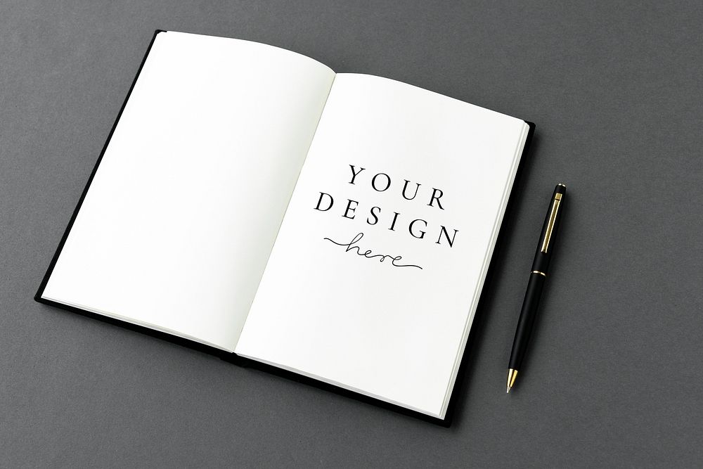 White notebook with a black pen mockup