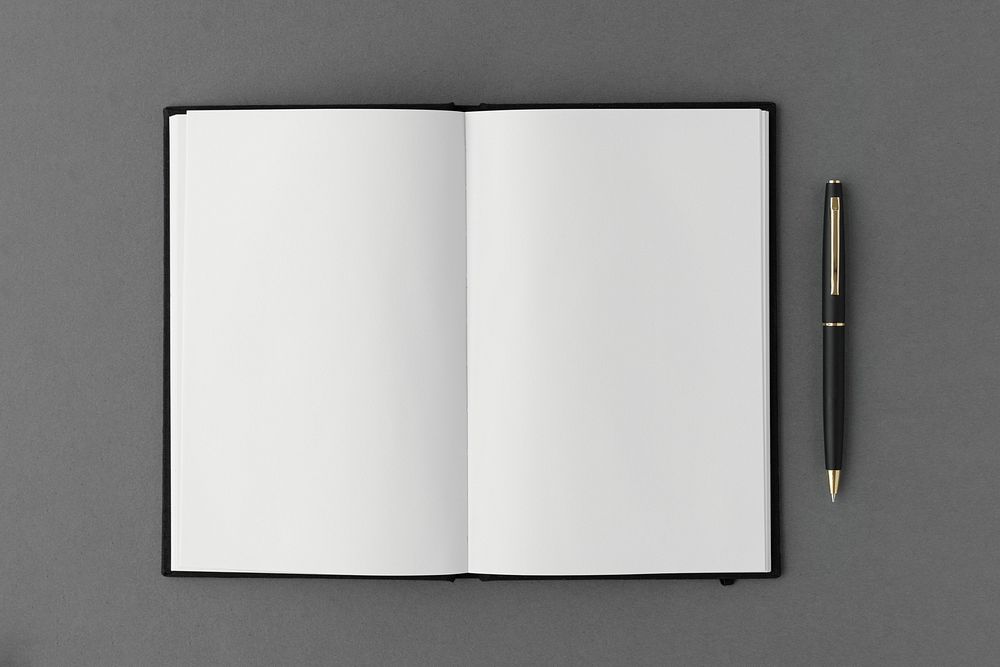 Blank plain white notebook with a pen