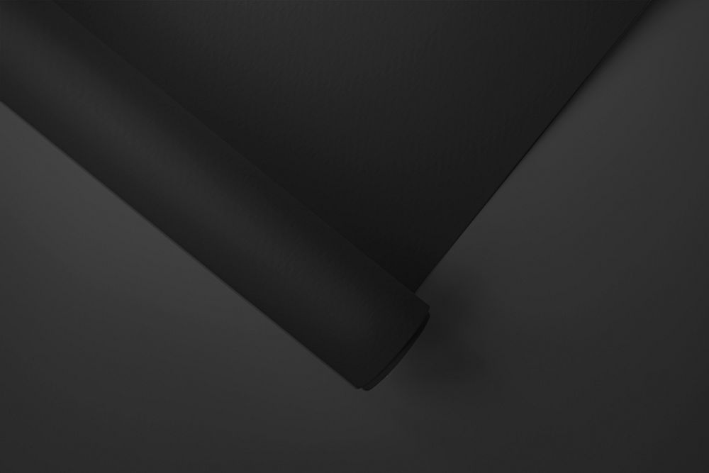 Rolled black chart paper on a dark gray background