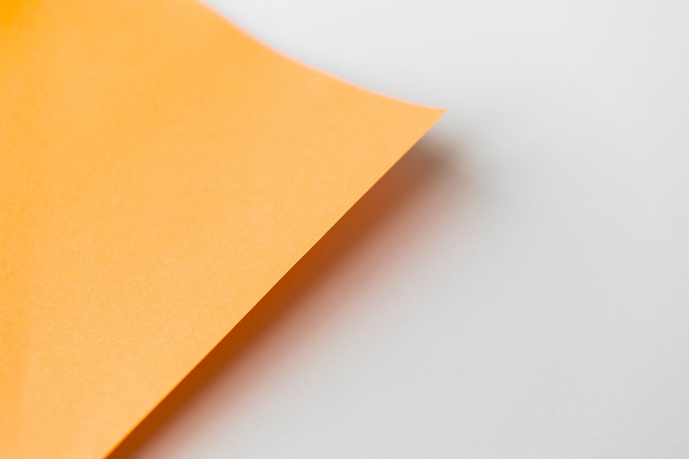 Blank orange paper on a gray background