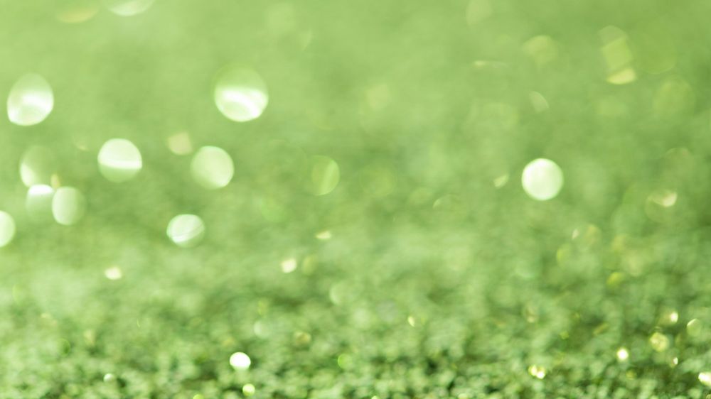 Shiny green glitter textured background