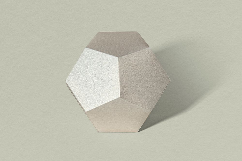 3D silver pentagon shaped paper craft on a sage green background