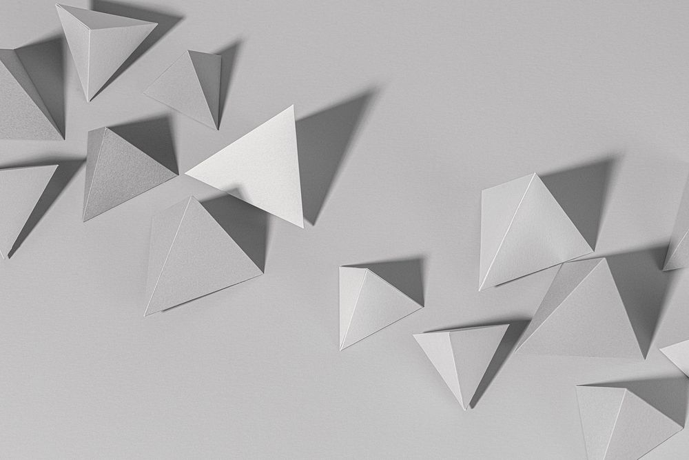 3D gray pyramid paper craft on a gray background