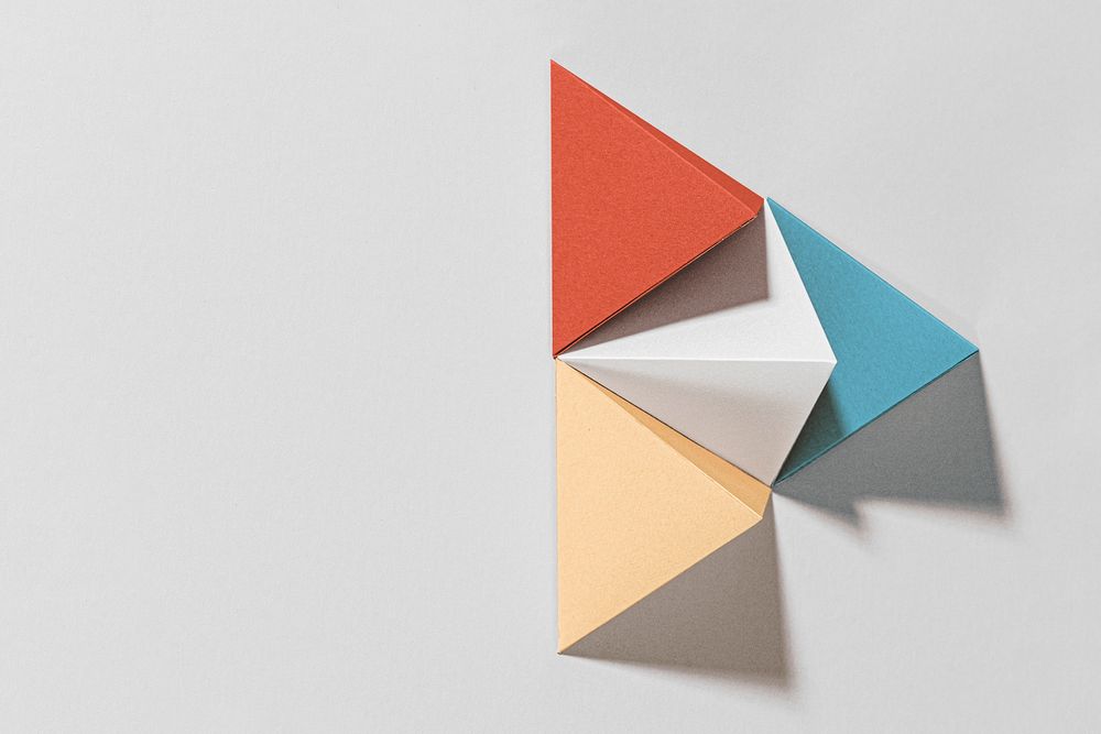 3D colorful pyramid paper craft on a gray background