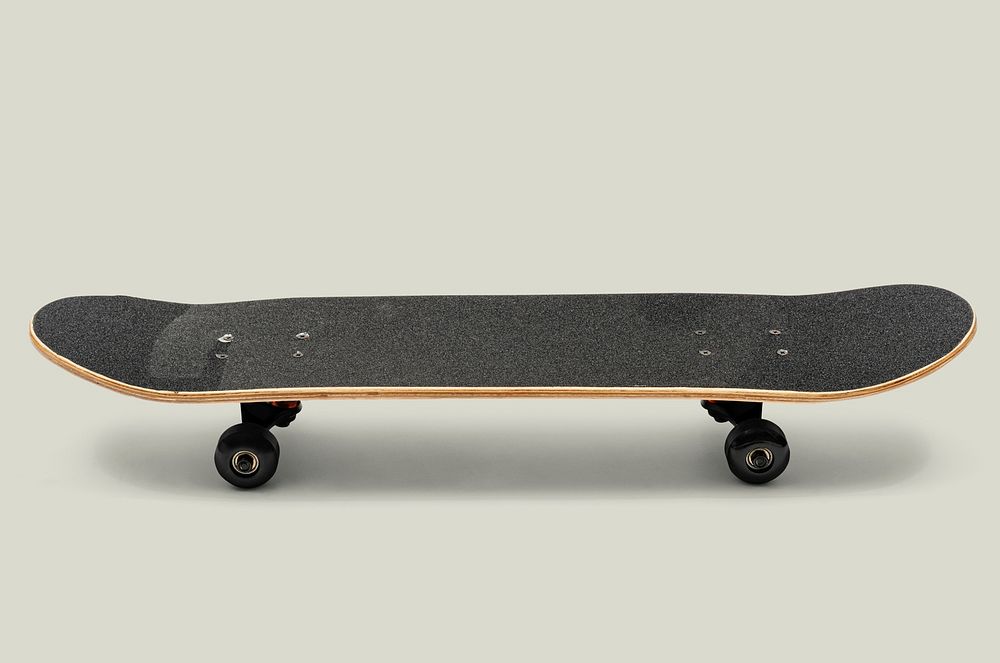 Black skateboard on off white background mockup