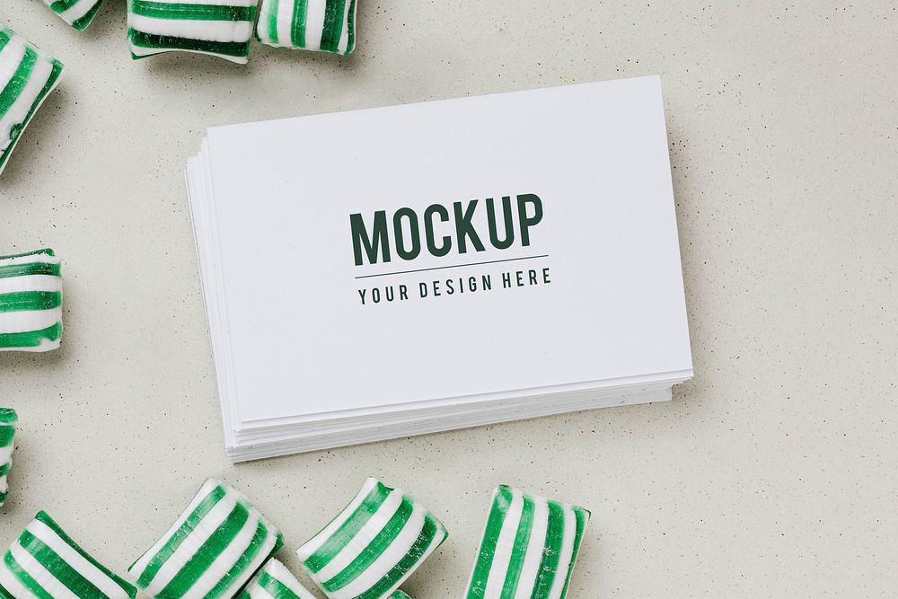 Business card mockup surrounded by candies 