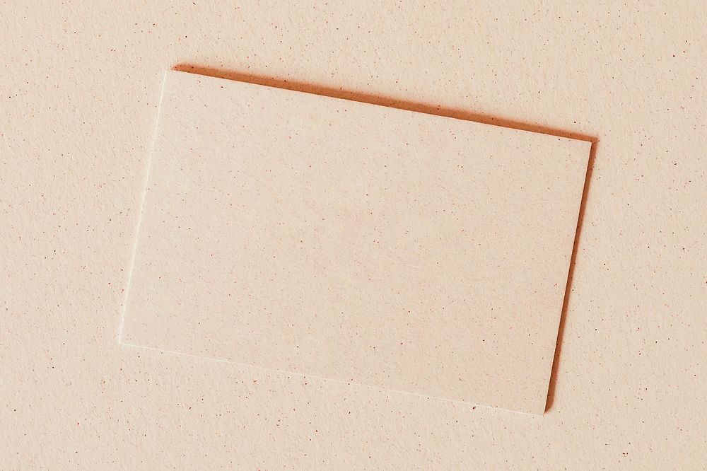 Blank business card on beige background