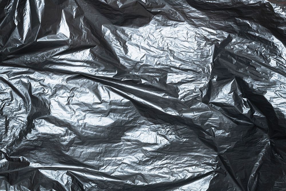 Disposable black garbage bag texture 