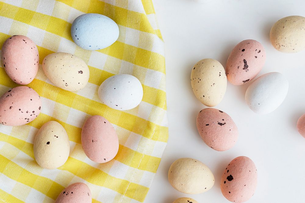 Chocolate Easter eggs on a yellow cloth flatlay