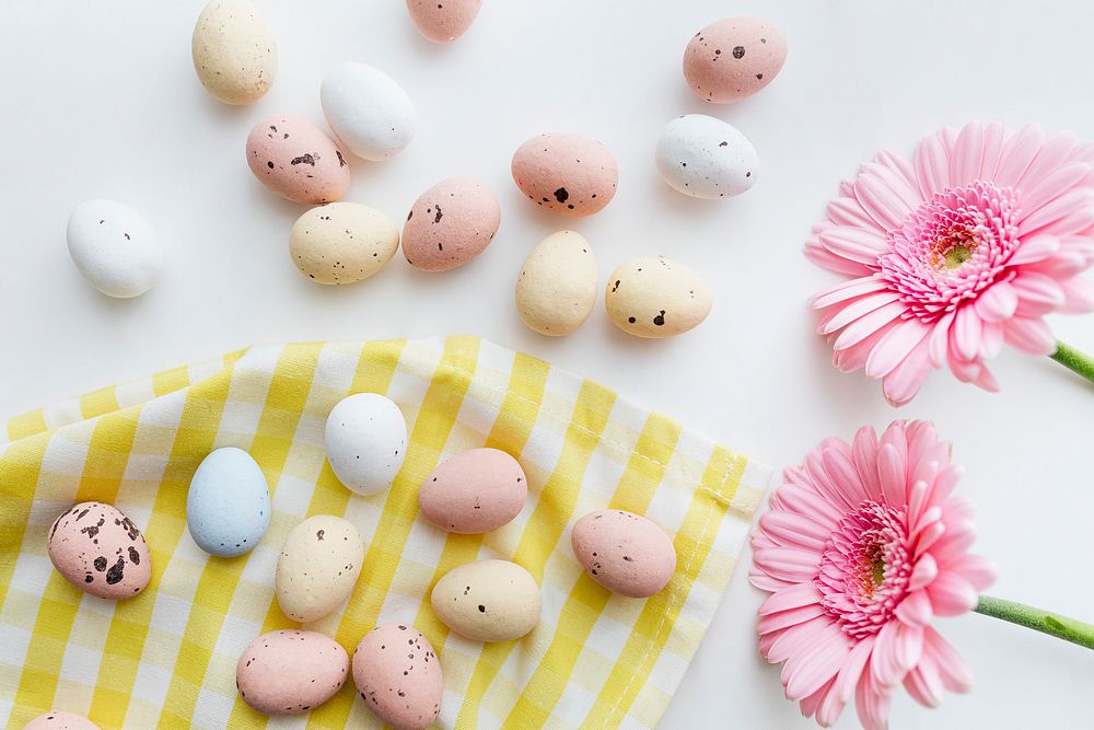 Chocolate Easter eggs and pink gerbera flatlay