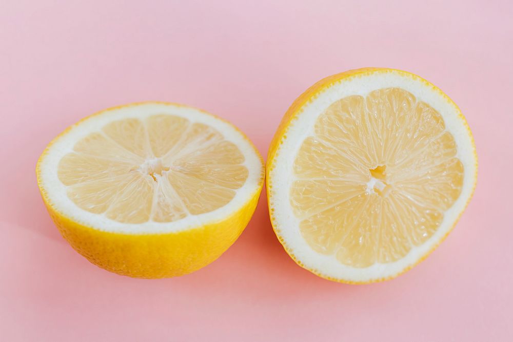 Fresh lemon on pink background