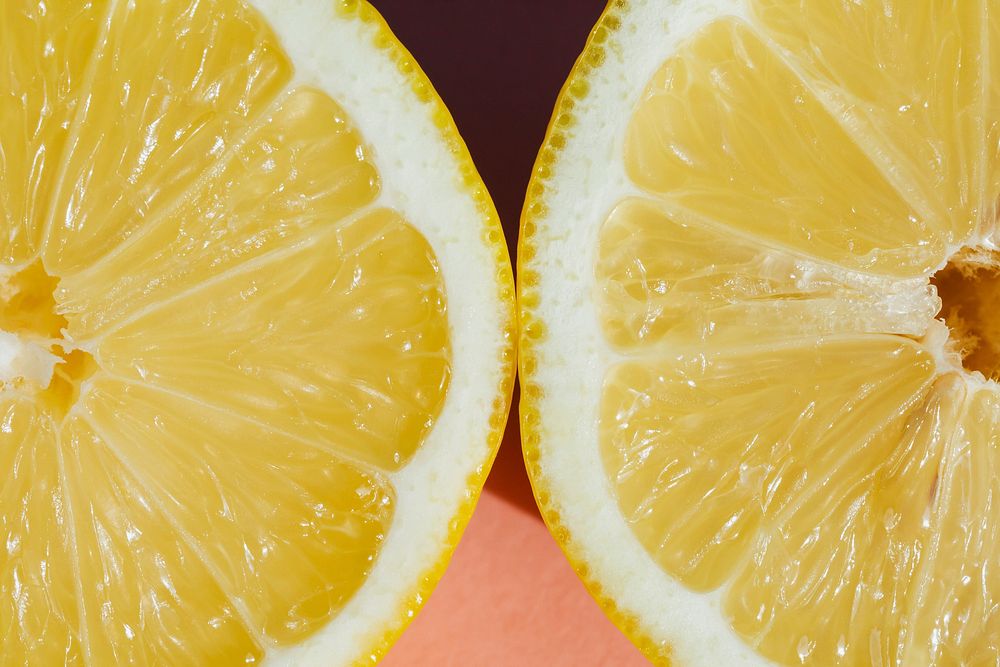 Fresh lemon on pink background
