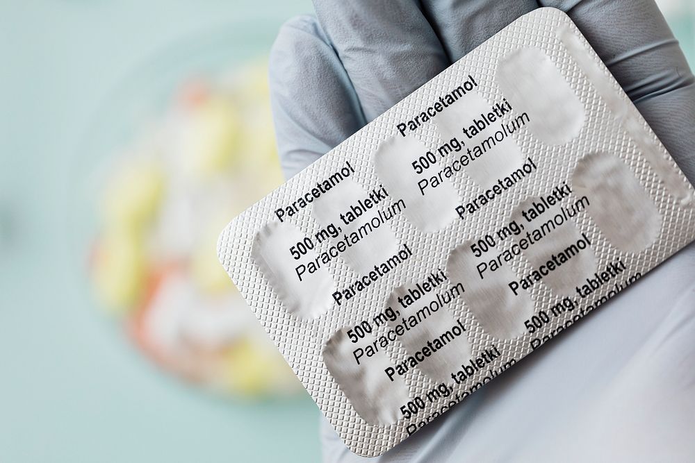 Pharmacist holding paracetamol pain killers