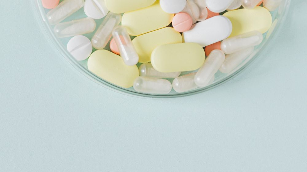 Colorful tablets in a bowl flatlay
