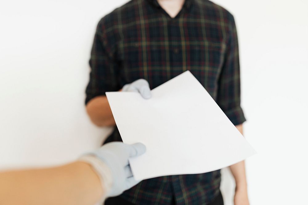 Man receiving a blank white paper