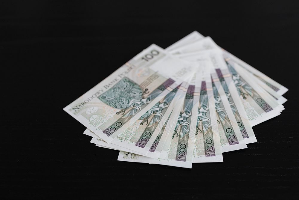 Polish Zloty banknotes on a black background